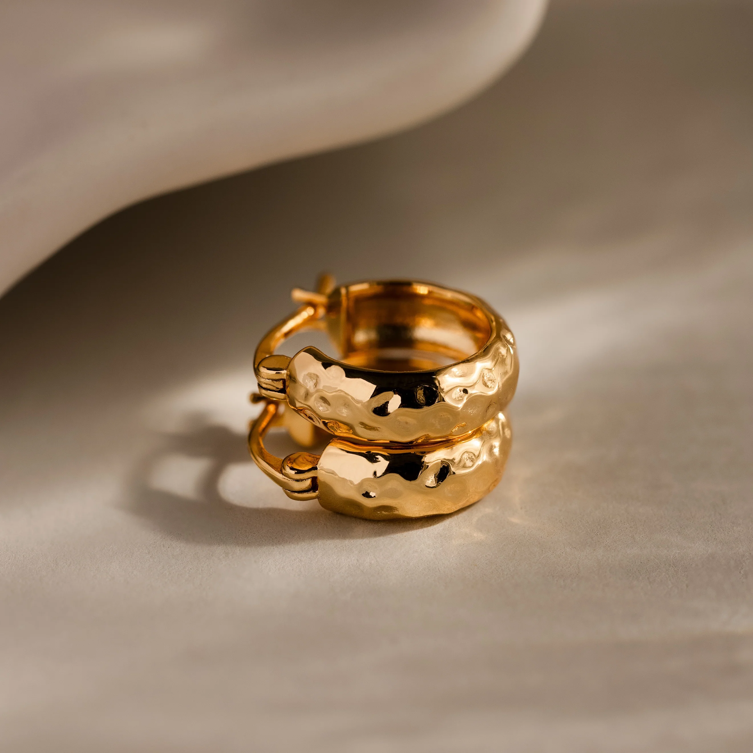 Bold Hammered Huggies in 18K Gold - Image 7