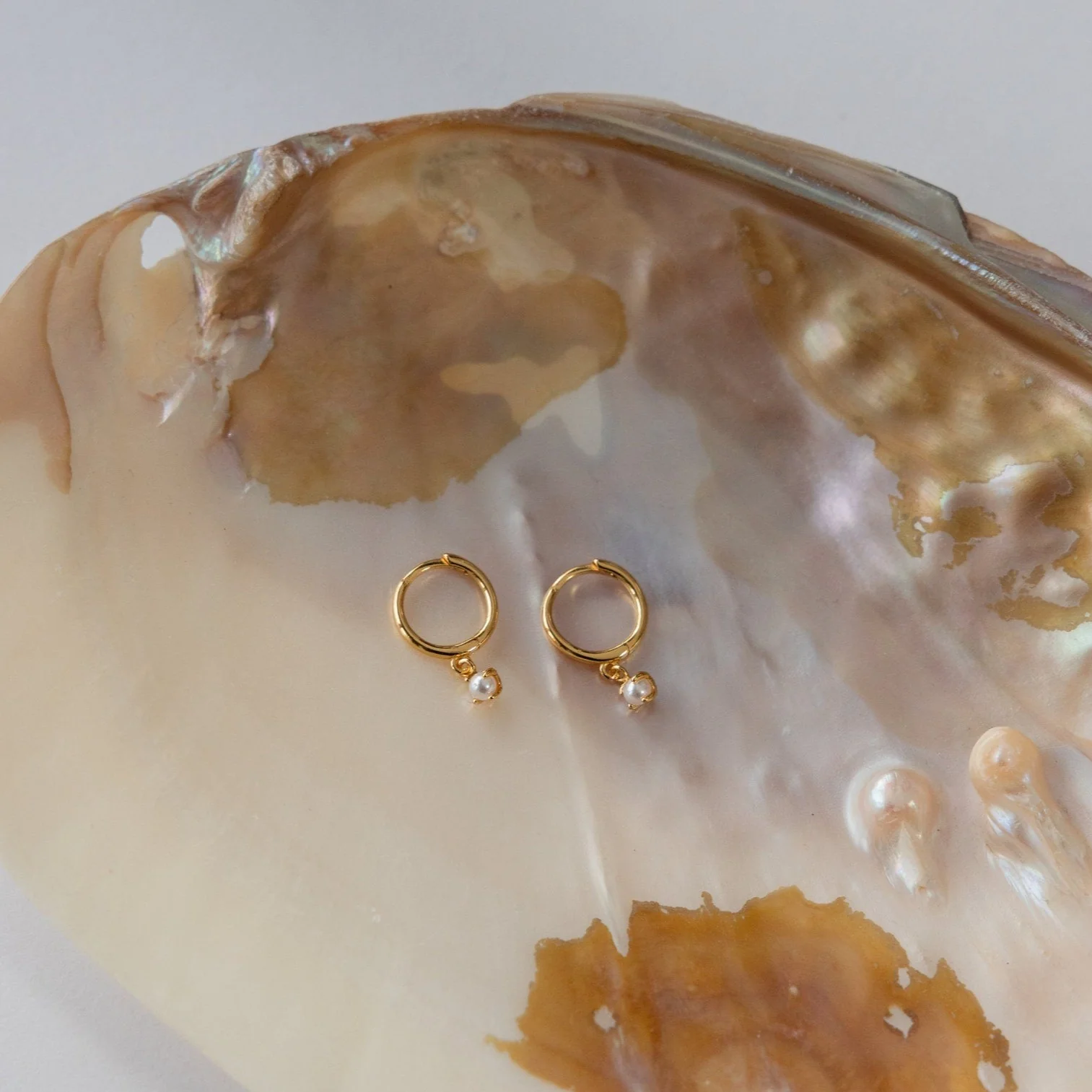 Molly Pearl Huggies in 18K Gold - Image 2